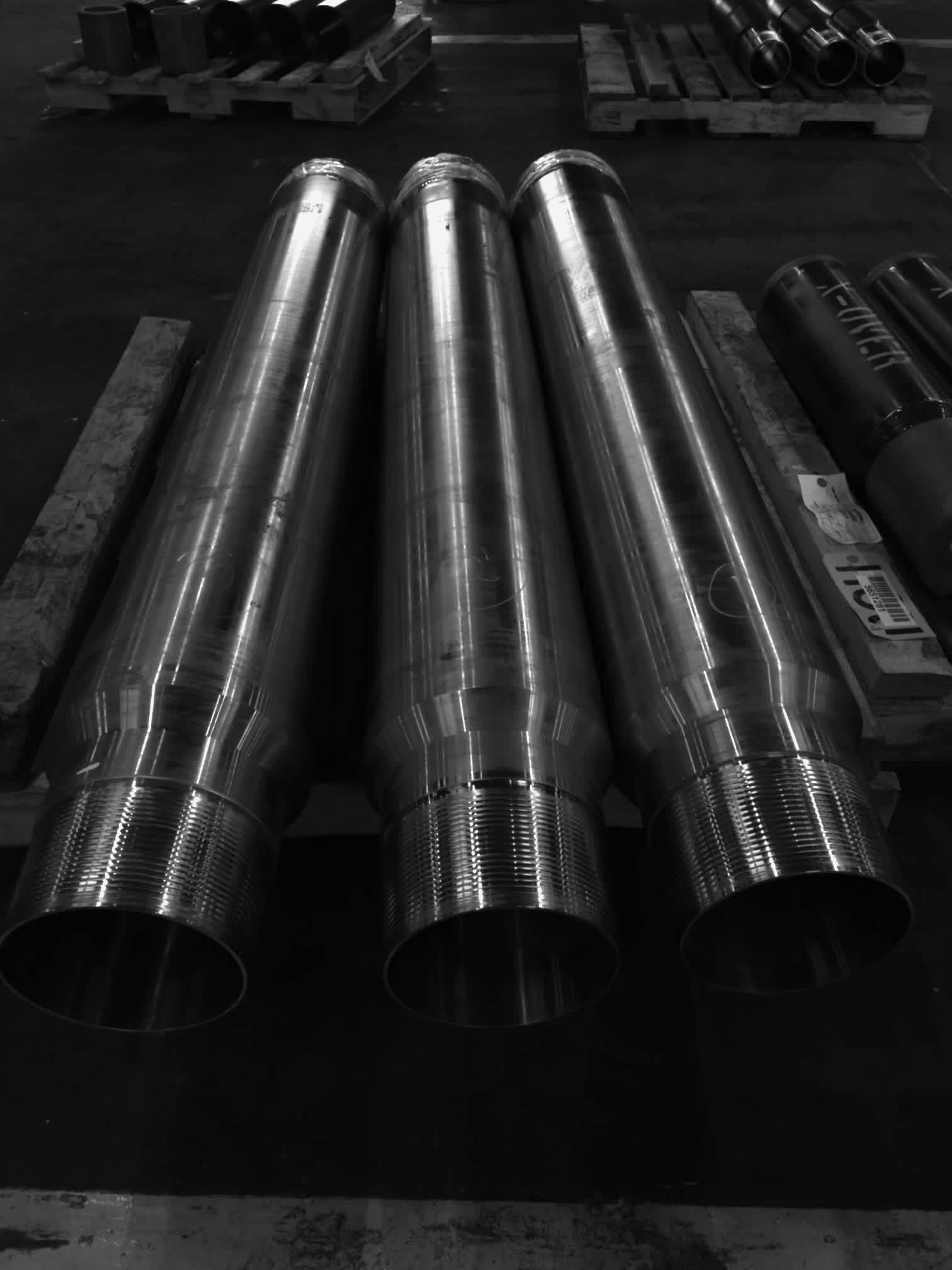 Three freshly machined casing pup joints with premium pin-end threads staged in the Delta Solutions Magnolia yard