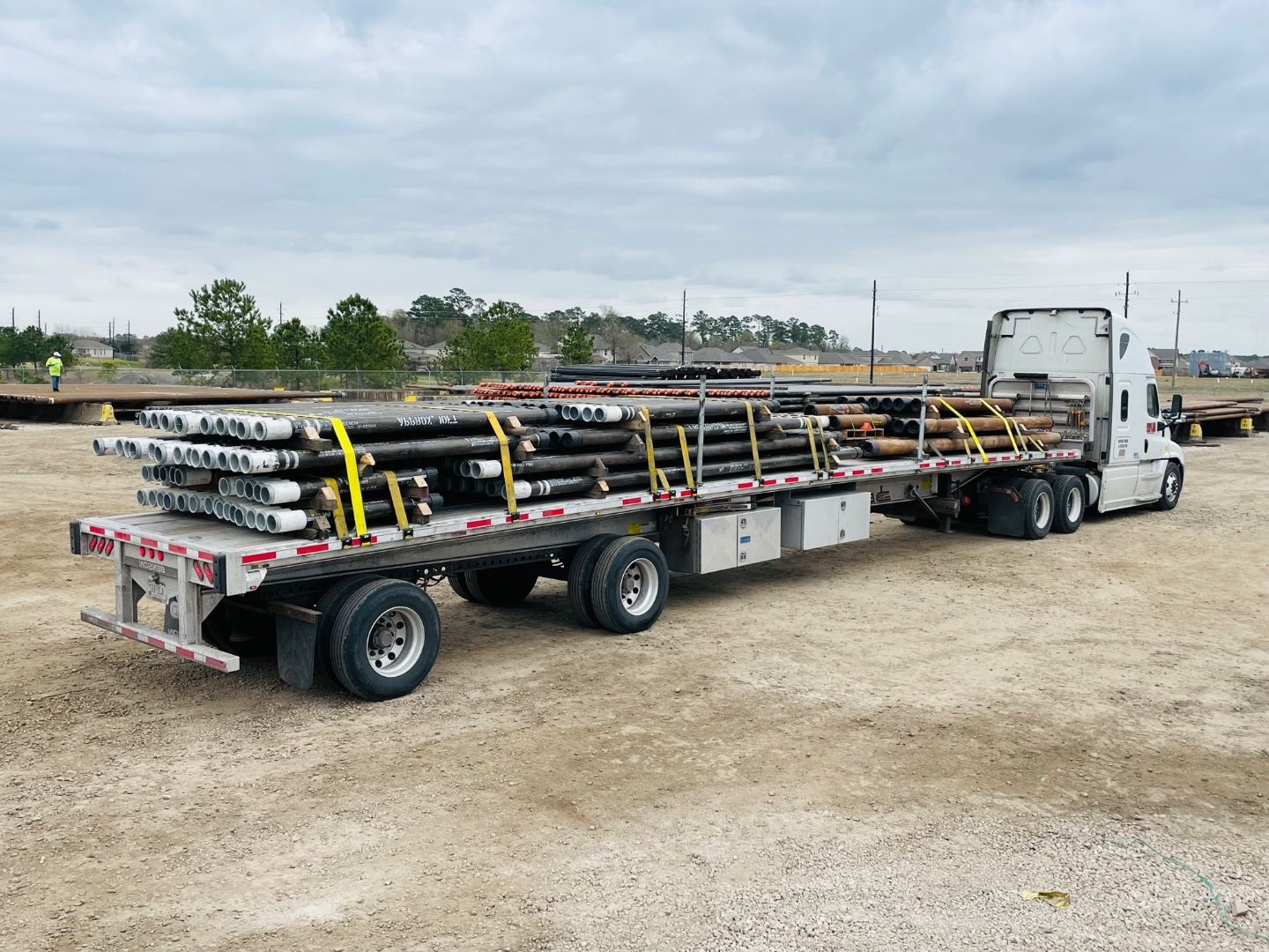 Loaded flatbed FTL of tubulars strapped and staged for delivery from the Delta Solutions Magnolia yard