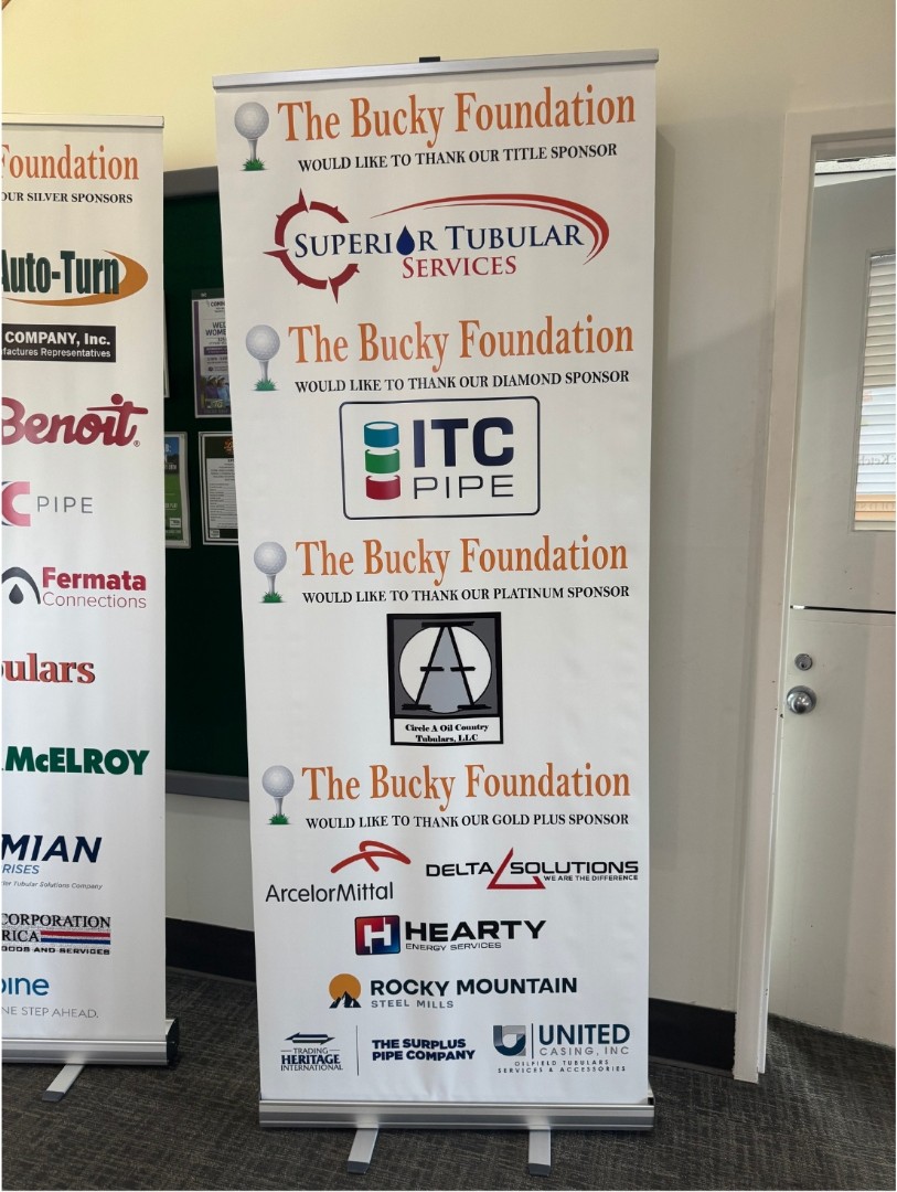 The Bucky Foundation sponsor recognition banner featuring Delta Solutions